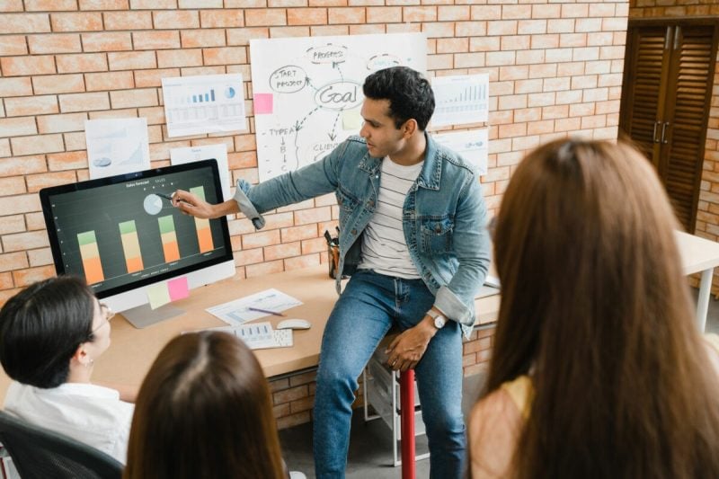 business people using computer presentation