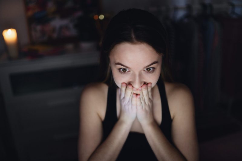 worried young girl with laptop