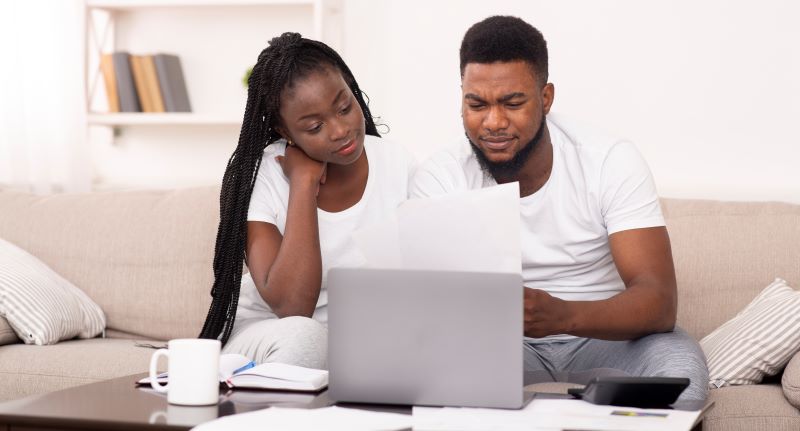 Couple work on lap top