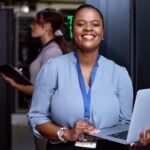 smiling woman with laptop
