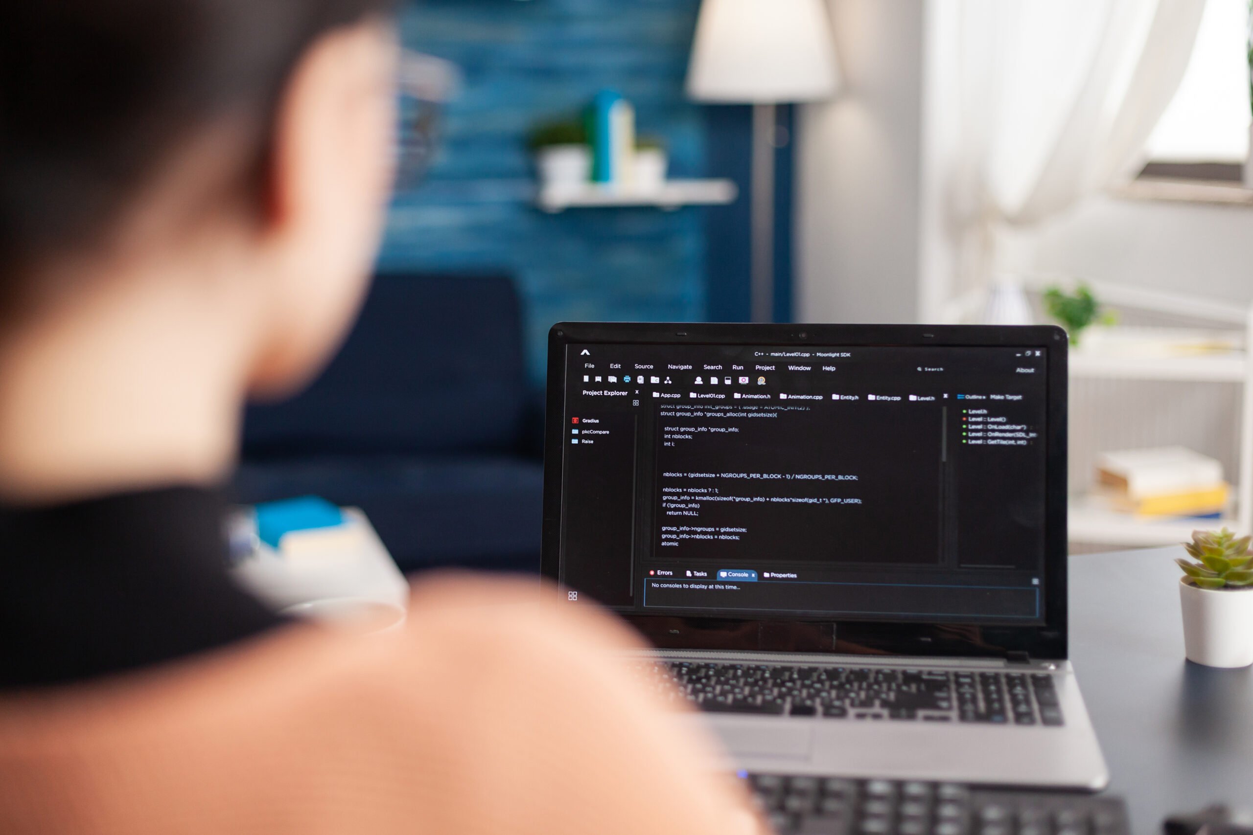 Young programmer writing virtual program code for software development