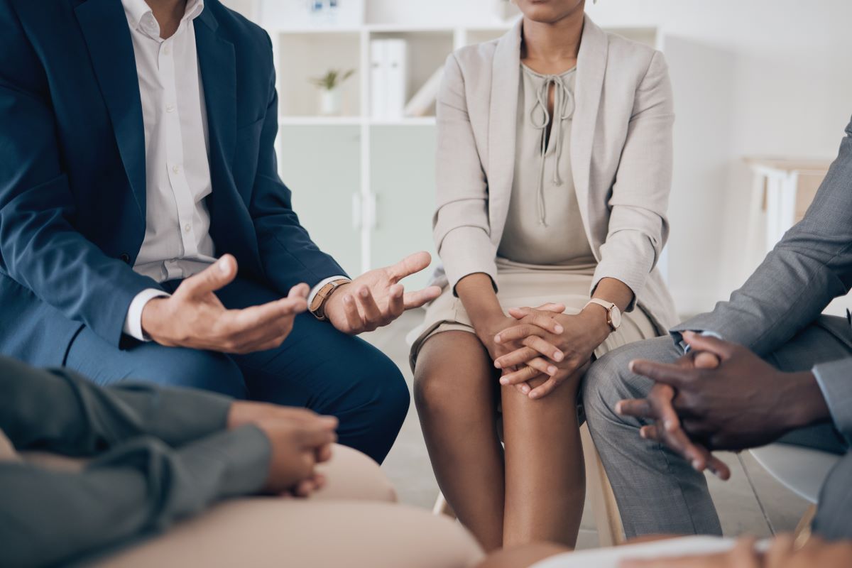 four people talking