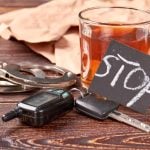 handcuffs car keys and whisky