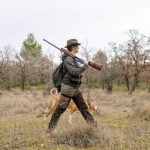hunter woman with shotgun