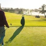 young man plays golf