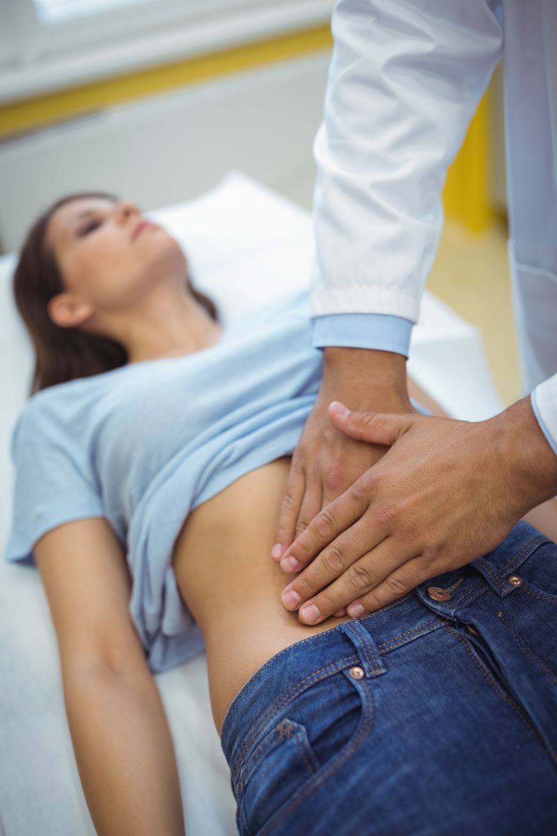 doctor gastroenterologist examining the stomach