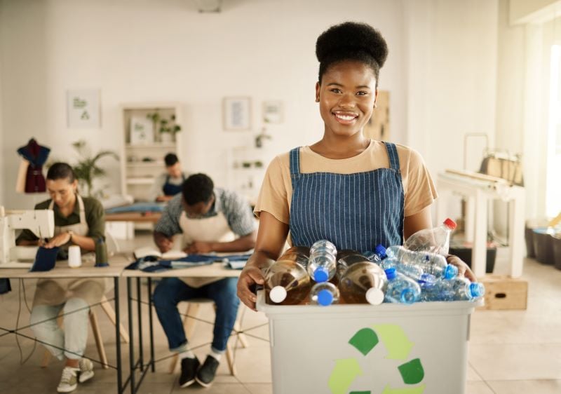 girl recycling plastic bottles