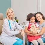 girl with her mother and pediatrist
