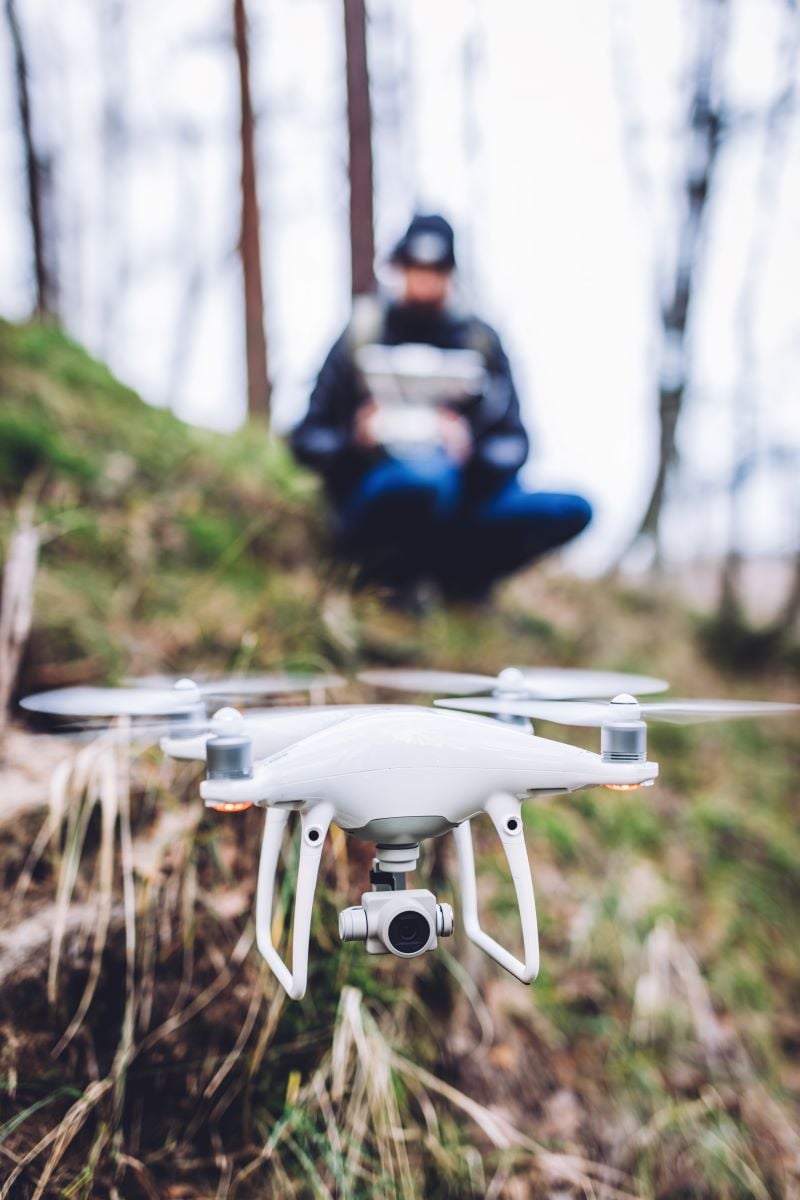 man operating a drone