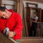 carpenter using plane