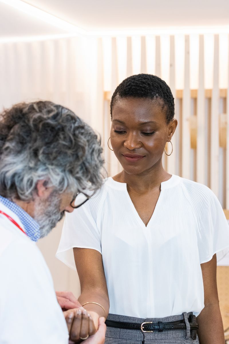 doctor measuring pulse of patient