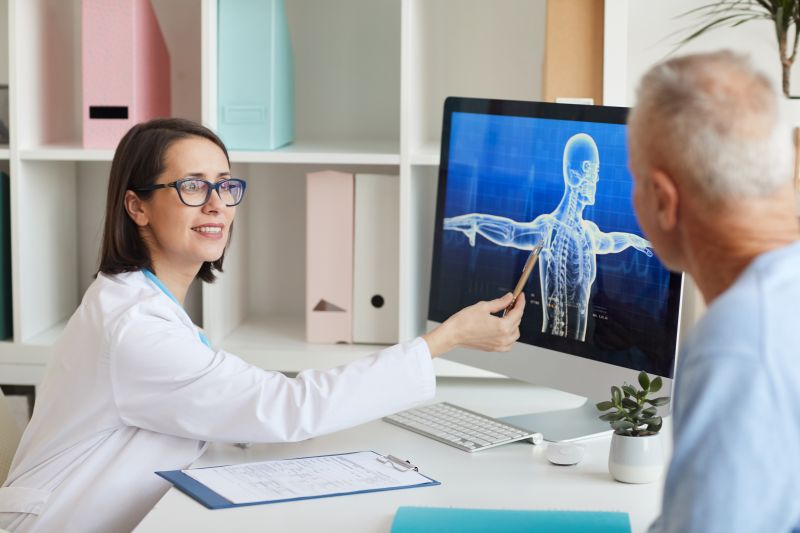 doctor talking to senior patient
