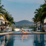 the woman relaxing near beautiful swimming pool