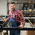 worker connecting metal parts
