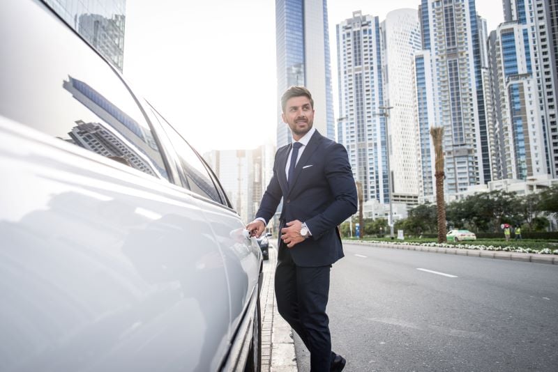 businessman-opening door on the car