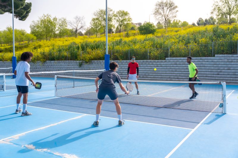 friends playing pickleball